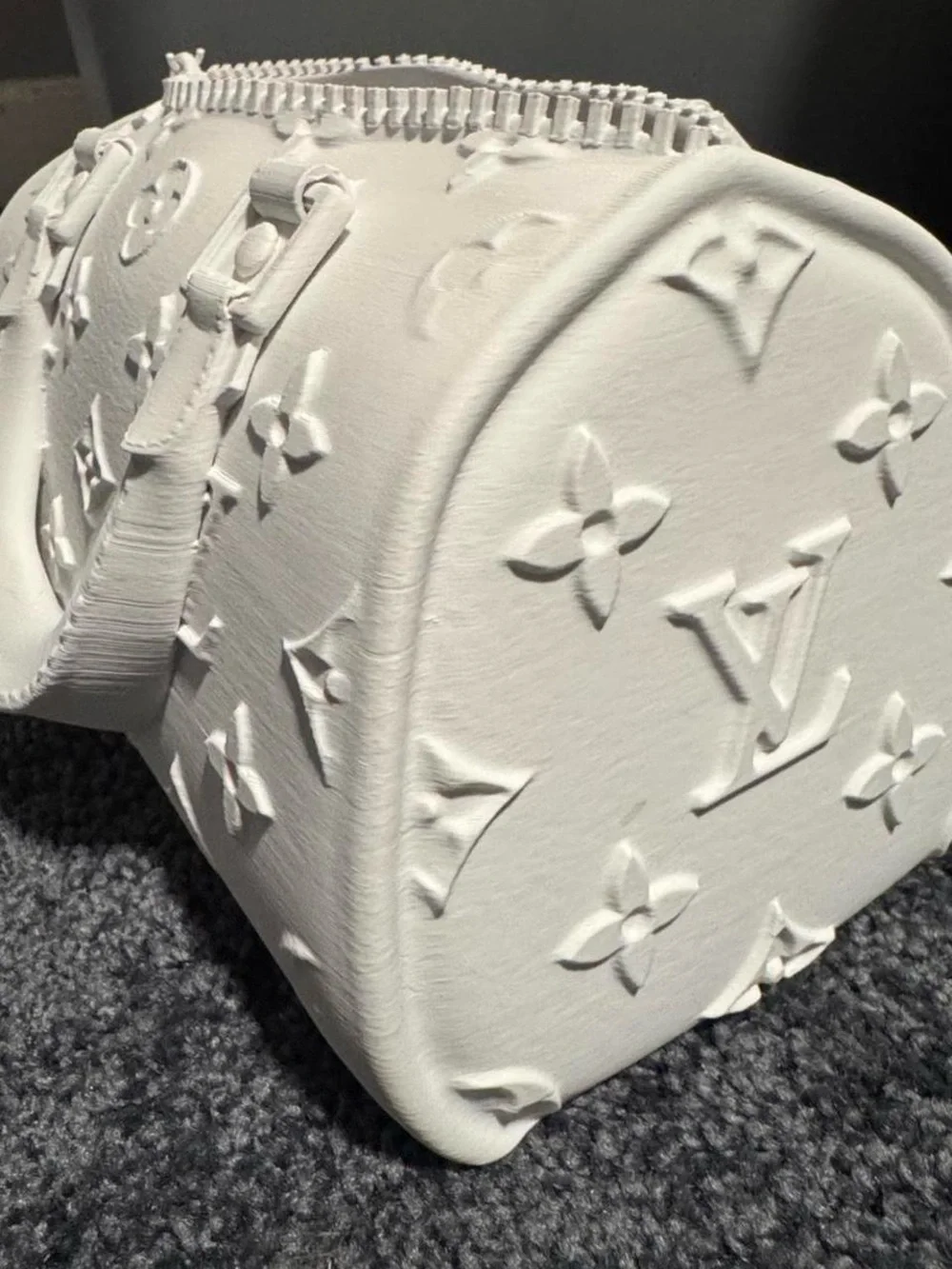 White 3D printed handbag with embossed monogram pattern